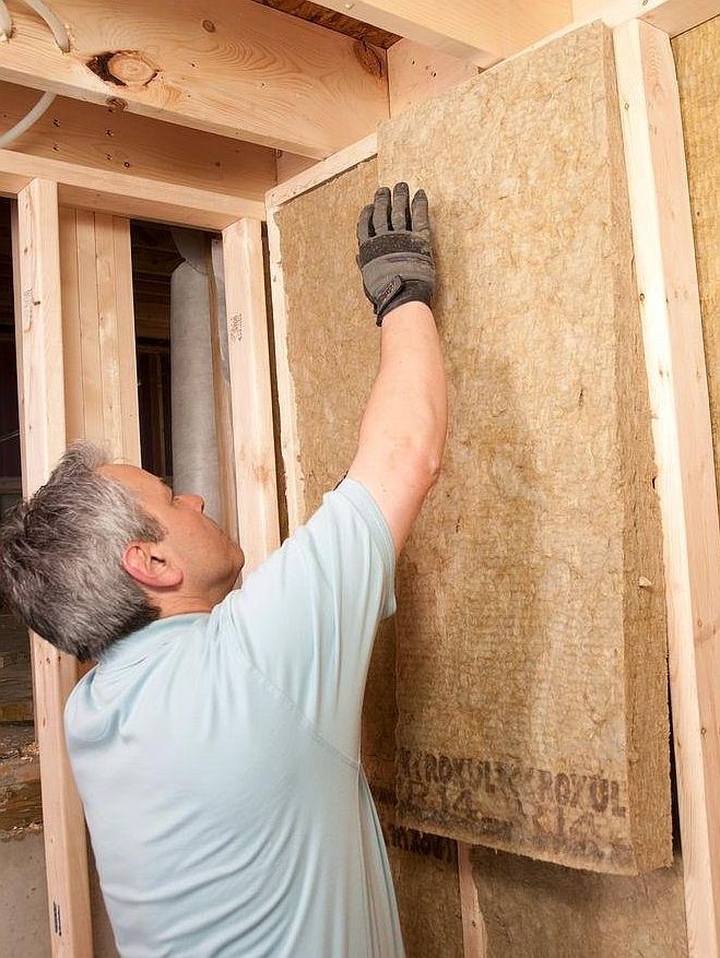 Installing a mineral wool insulation batt